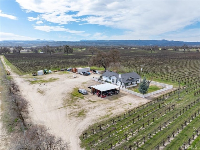 birds eye view of property featuring a mountain view and a rural view