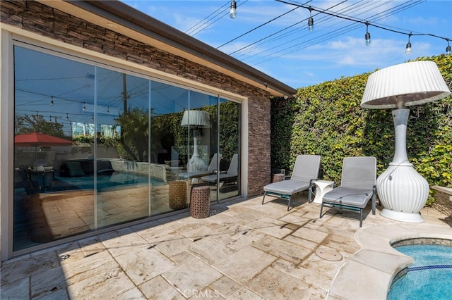 view of patio / terrace with an outdoor pool