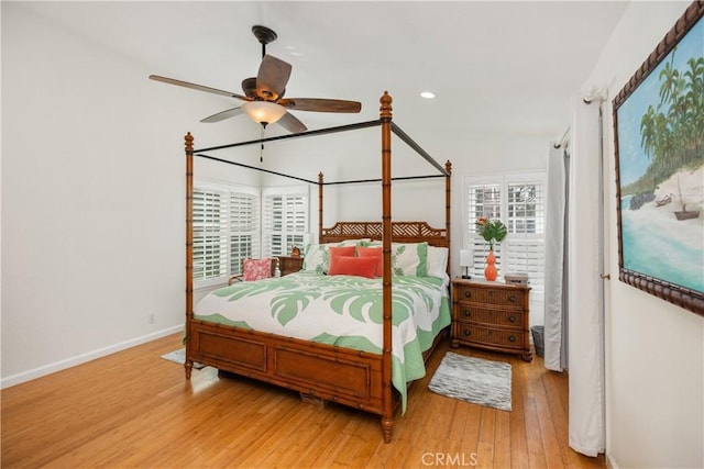 bedroom with recessed lighting, ceiling fan, light wood-style flooring, and baseboards