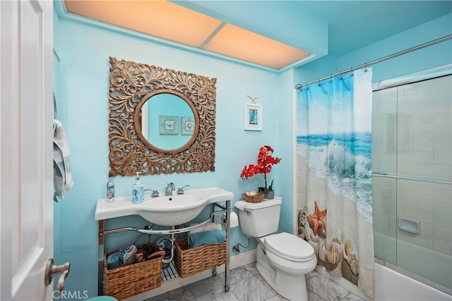 bathroom with baseboards, toilet, enclosed tub / shower combo, marble finish floor, and a sink