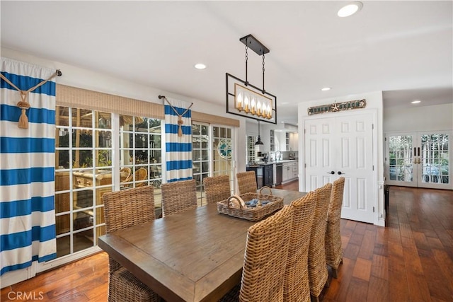 dining area with recessed lighting, wood-type flooring, and french doors