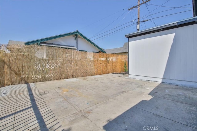 view of patio / terrace featuring fence