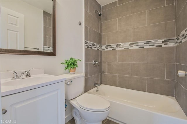 full bath featuring tub / shower combination, vanity, and toilet