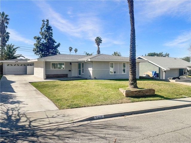 ranch-style house with a garage, a front yard, driveway, and stucco siding