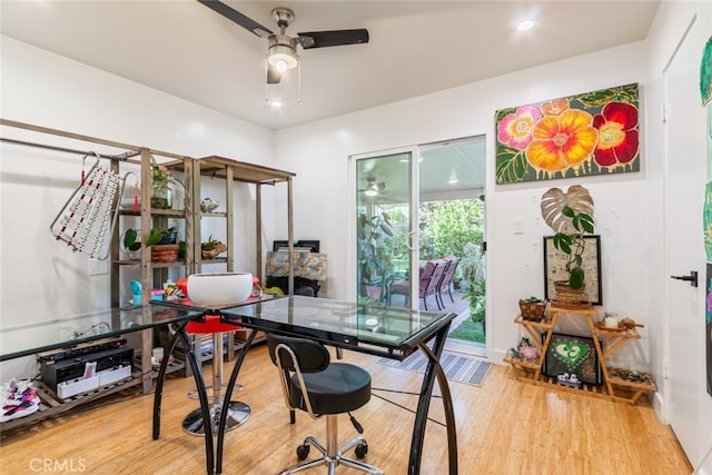 office with a ceiling fan and wood finished floors