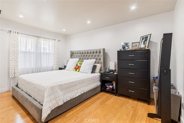 bedroom with recessed lighting and light wood finished floors