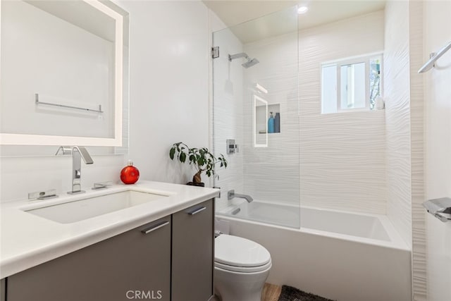 full bathroom featuring toilet, bathtub / shower combination, and vanity