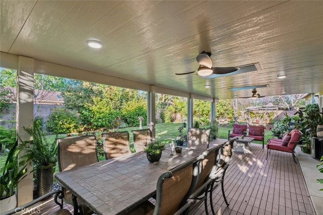 exterior space with an outdoor living space, outdoor dining area, and ceiling fan