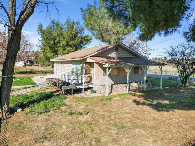 view of outdoor structure with fence