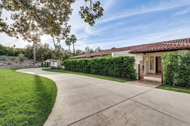 surrounding community with a yard and an outdoor structure