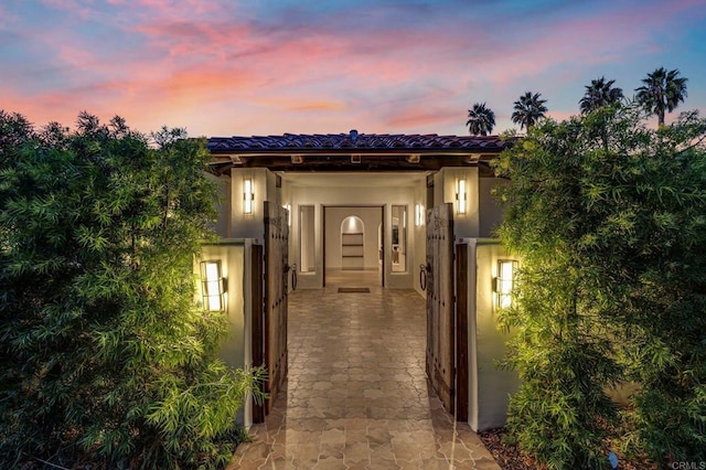 view of exterior entry with stucco siding