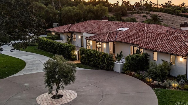 7102 Via De Maya, Rancho Santa Fe, CA 92067 - mediterranean / spanish house featuring a tile roof, stucco siding, a chimney, and a front yard