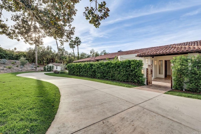 7102 Via De Maya, Rancho Santa Fe, CA 92067 - exterior space featuring a front yard, stucco siding, and a tile roof