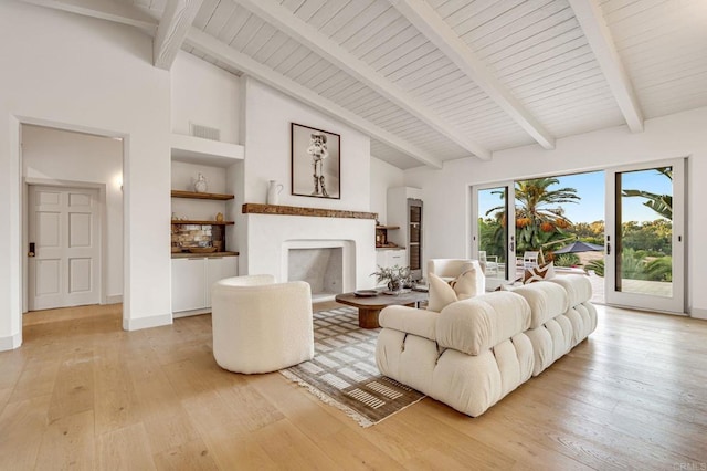 7102 Via De Maya, Rancho Santa Fe, CA 92067 - living area with light wood-type flooring, high vaulted ceiling, a fireplace, built in shelves, and beamed ceiling