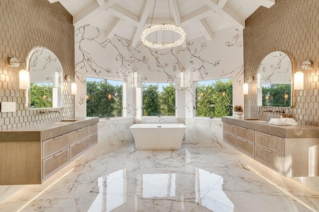 7102 Via De Maya, Rancho Santa Fe, CA 92067 - full bath with high vaulted ceiling, beam ceiling, marble tiled floors, a freestanding bath, and two vanities