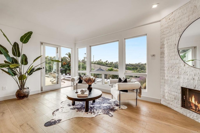 7102 Via De Maya, Rancho Santa Fe, CA 92067 - living room with wood-type flooring and a fireplace