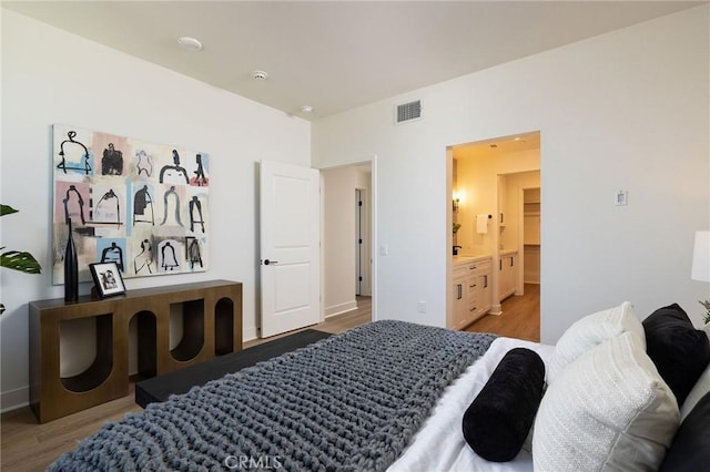 414 Main Unit 230, Huntington Beach, CA 92648 - bedroom featuring wood finished floors and visible vents