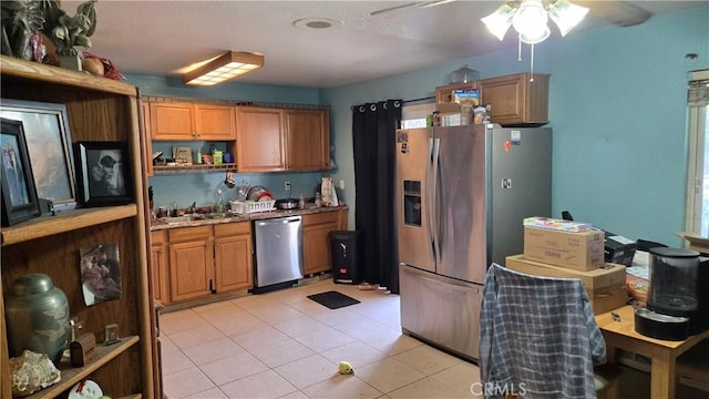 kitchen with light tile patterned flooring, appliances with stainless steel finishes, light stone countertops, open shelves, and brown cabinetry