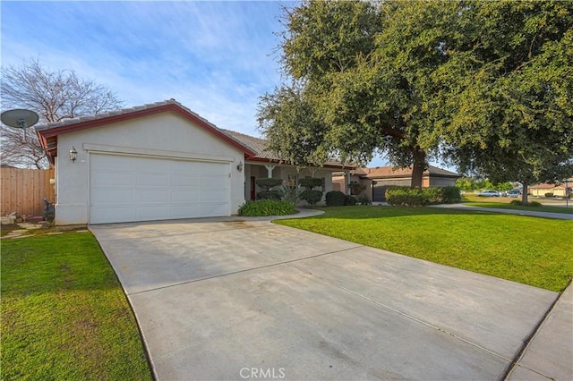 view of front facade featuring an attached garage, fence, driveway, stucco siding, and a front lawn