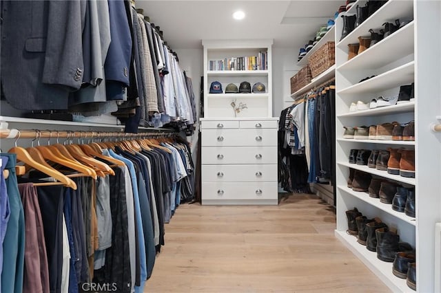 spacious closet featuring light wood-style flooring