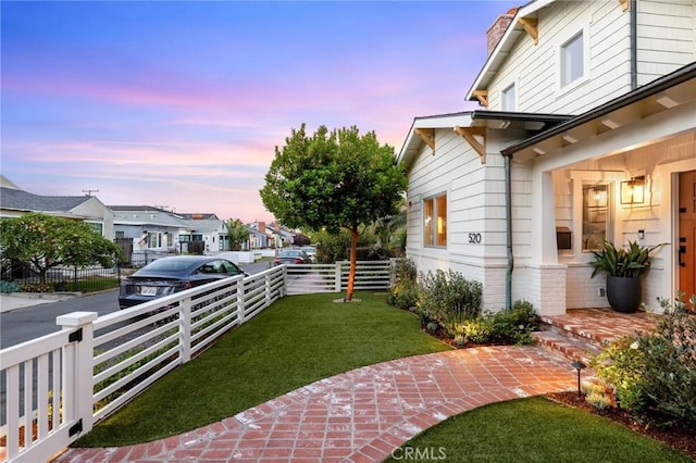 view of yard with fence and a residential view