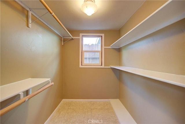 spacious closet featuring tile patterned floors