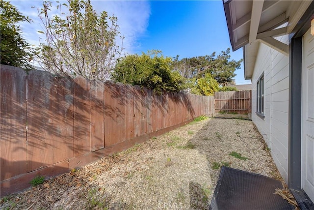 view of yard with a fenced backyard