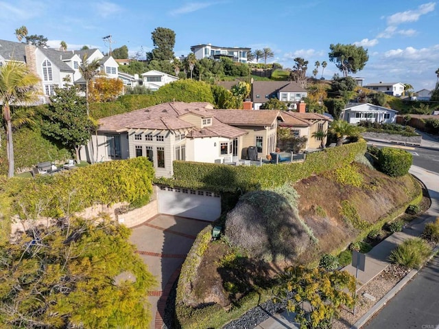 birds eye view of property with a residential view