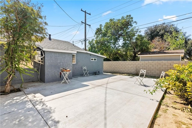 view of patio featuring fence