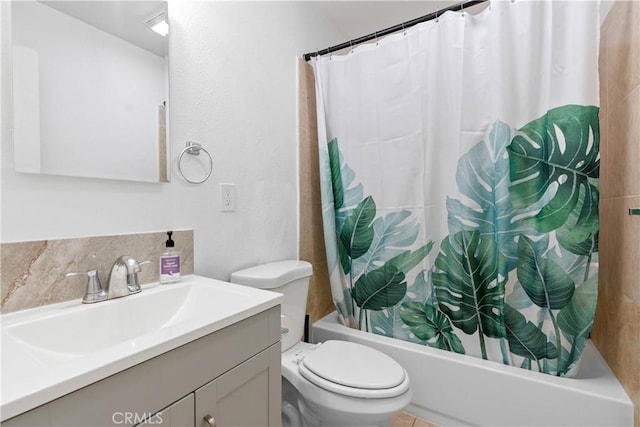 bathroom featuring decorative backsplash, vanity, toilet, and shower / bath combo with shower curtain