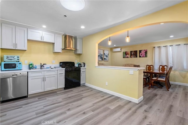 kitchen with white microwave, a sink, wall chimney range hood, black range with gas stovetop, and dishwasher