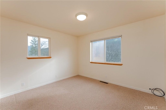 12625 Elk Mountain Rd, Upper Lake, CA 95485 - spare room featuring baseboards, light colored carpet, and visible vents