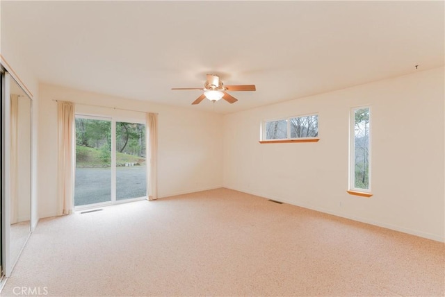 12625 Elk Mountain Rd, Upper Lake, CA 95485 - spare room with a ceiling fan, plenty of natural light, light colored carpet, and visible vents