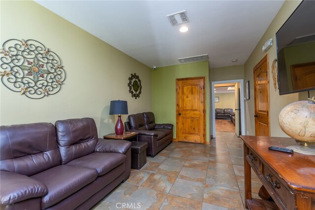 living area featuring visible vents