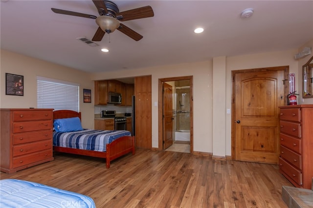 bedroom with light wood finished floors, baseboards, visible vents, ensuite bathroom, and recessed lighting