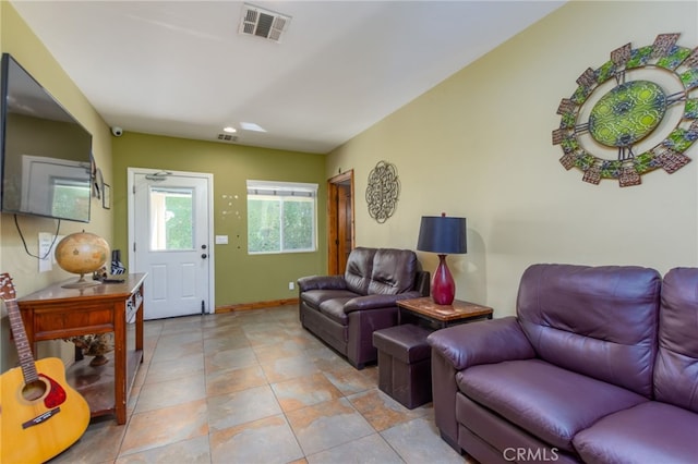 living room with visible vents and baseboards