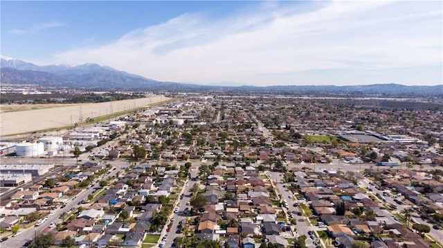 drone / aerial view featuring a residential view and a mountain view