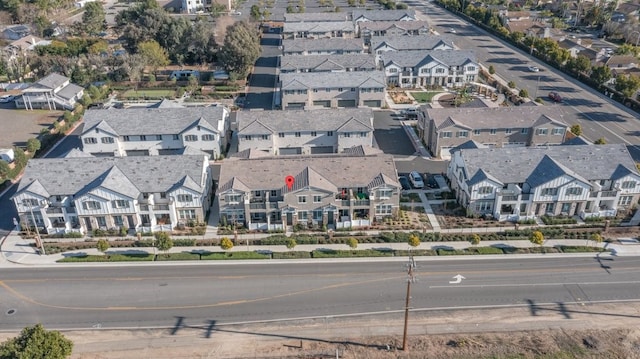 birds eye view of property with a residential view