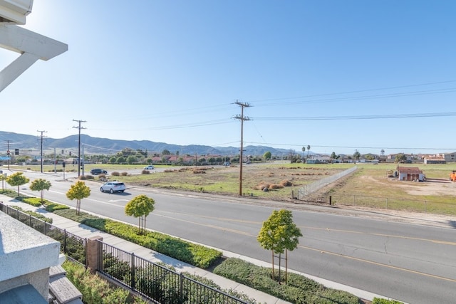 exterior space featuring a mountain view and sidewalks