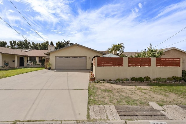 ranch-style house with a garage, concrete driveway, fence, and stucco siding