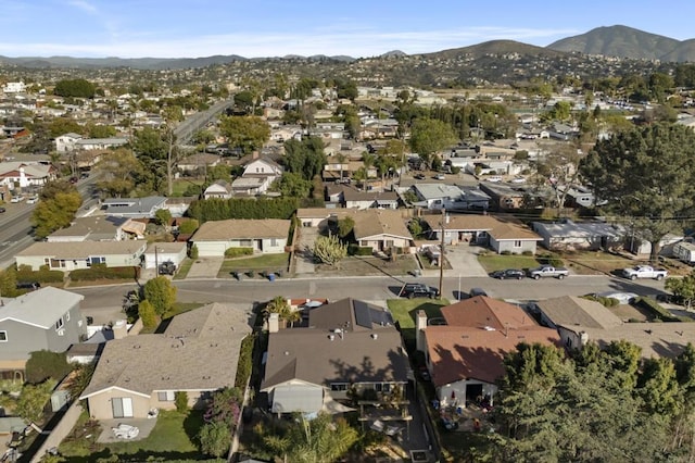 drone / aerial view featuring a residential view and a mountain view