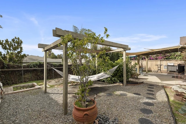 view of playground with a patio area and a fenced backyard