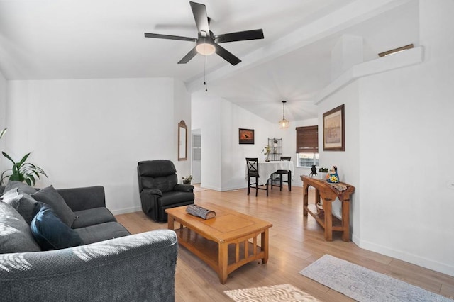 living room with vaulted ceiling with beams, light wood-style floors, ceiling fan, and baseboards