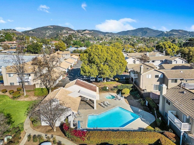 birds eye view of property with a residential view and a mountain view