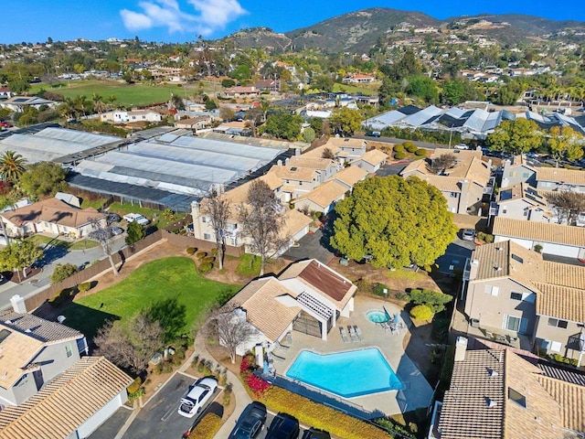 birds eye view of property featuring a mountain view and a residential view