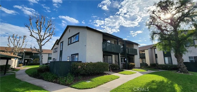 23230 Orange Ave Unit 2, Lake Forest, CA 92630 - view of front of house featuring stucco siding and a front lawn