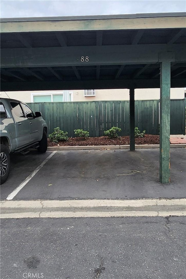 covered parking lot with fence