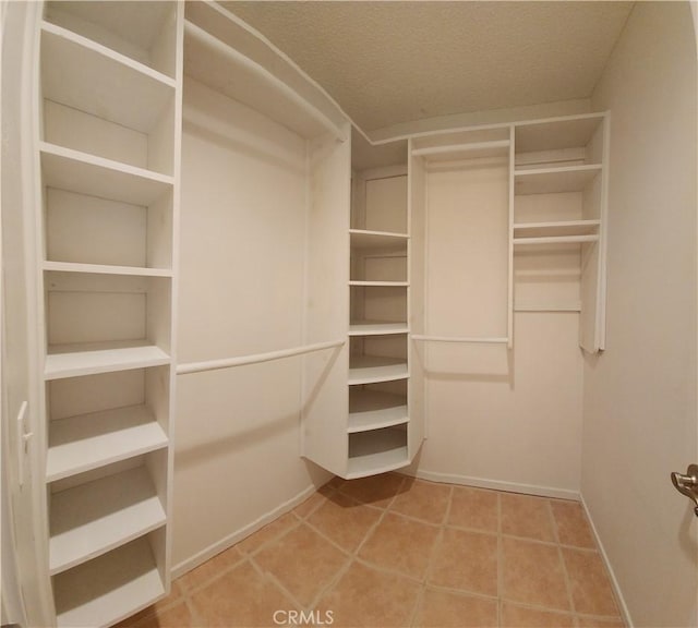 23230 Orange Ave Unit 2, Lake Forest, CA 92630 - walk in closet with tile patterned floors