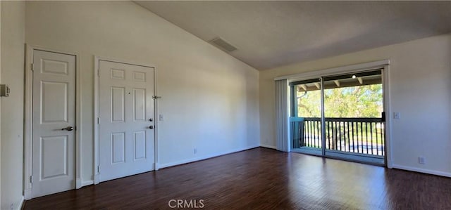 23230 Orange Ave Unit 2, Lake Forest, CA 92630 - spare room with lofted ceiling, dark wood-type flooring, and baseboards