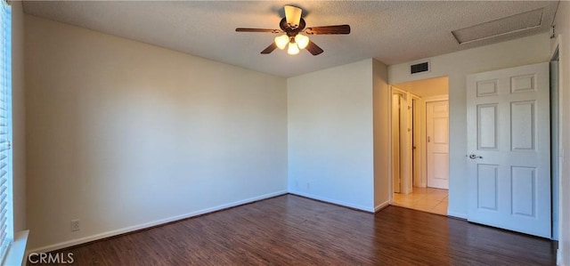 23230 Orange Ave Unit 2, Lake Forest, CA 92630 - spare room featuring dark wood finished floors, baseboards, a ceiling fan, and a textured ceiling